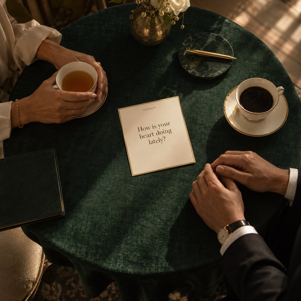 Two people with a VIDANITY question card at a green table